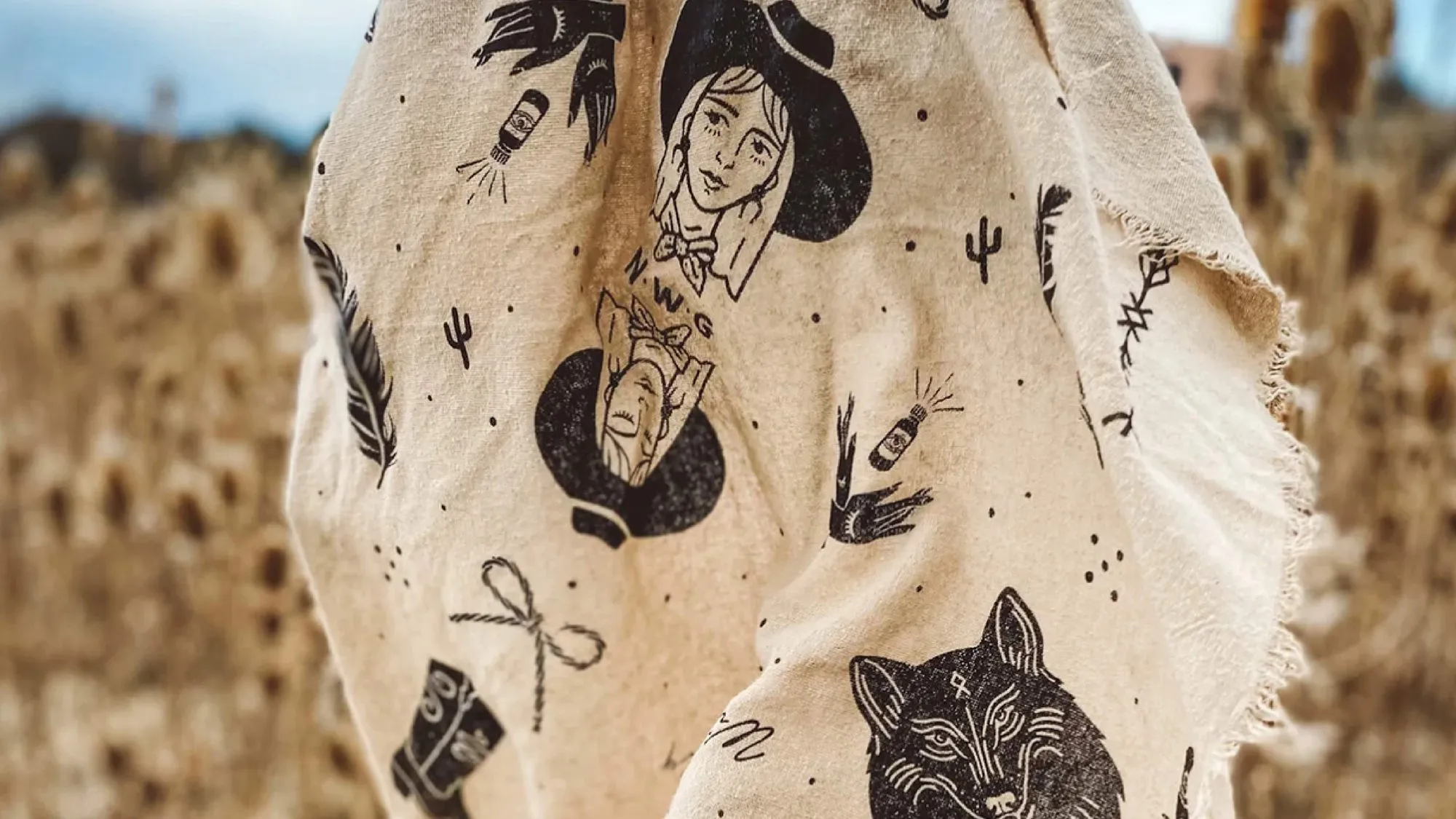A Night Wing Goods blanket printed with the brand's illustrations