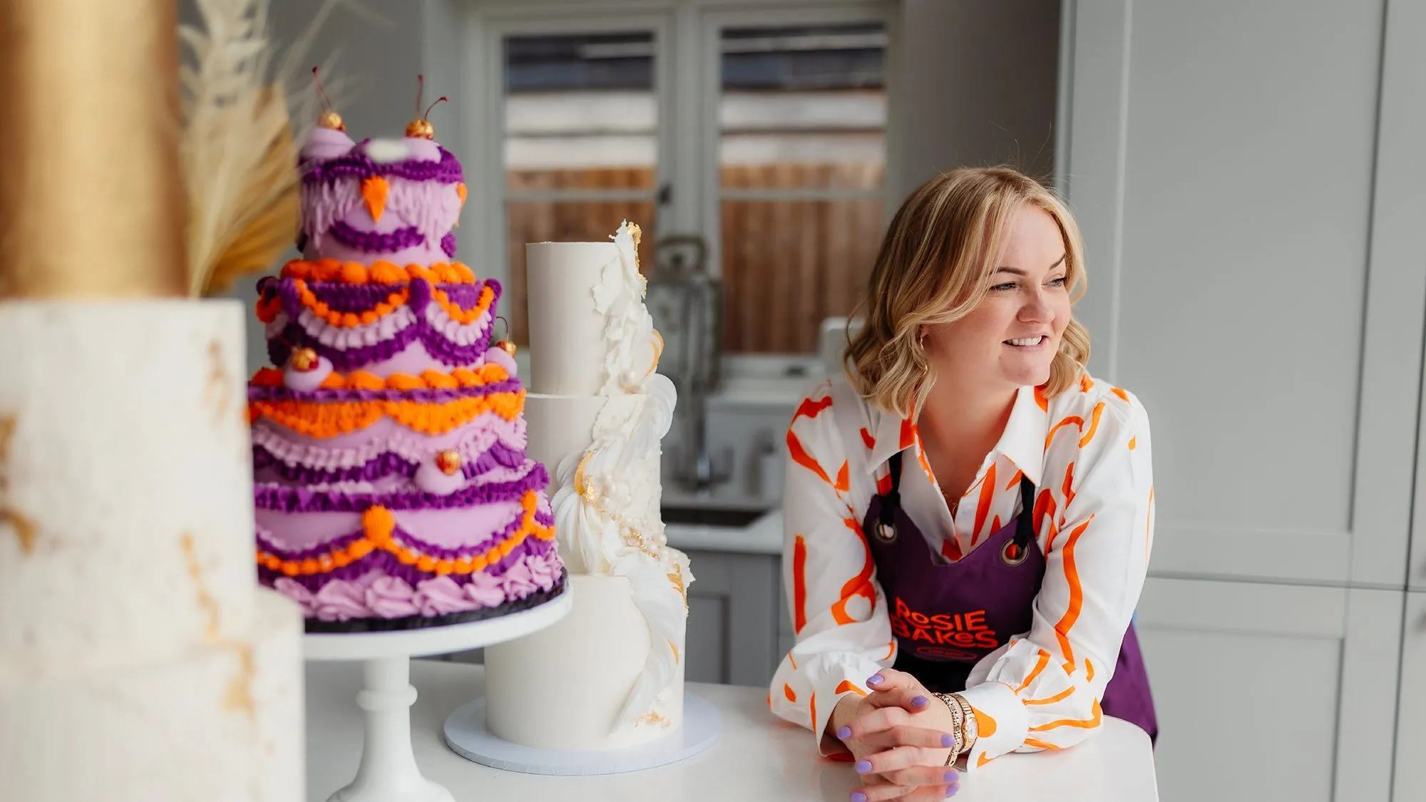 Rosie beside one of her wedding cakes