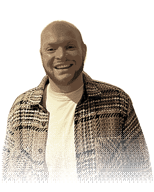 Oli Long, who runs Pixol, smiling in a checked overshirt, drawn in warm dithered pixels