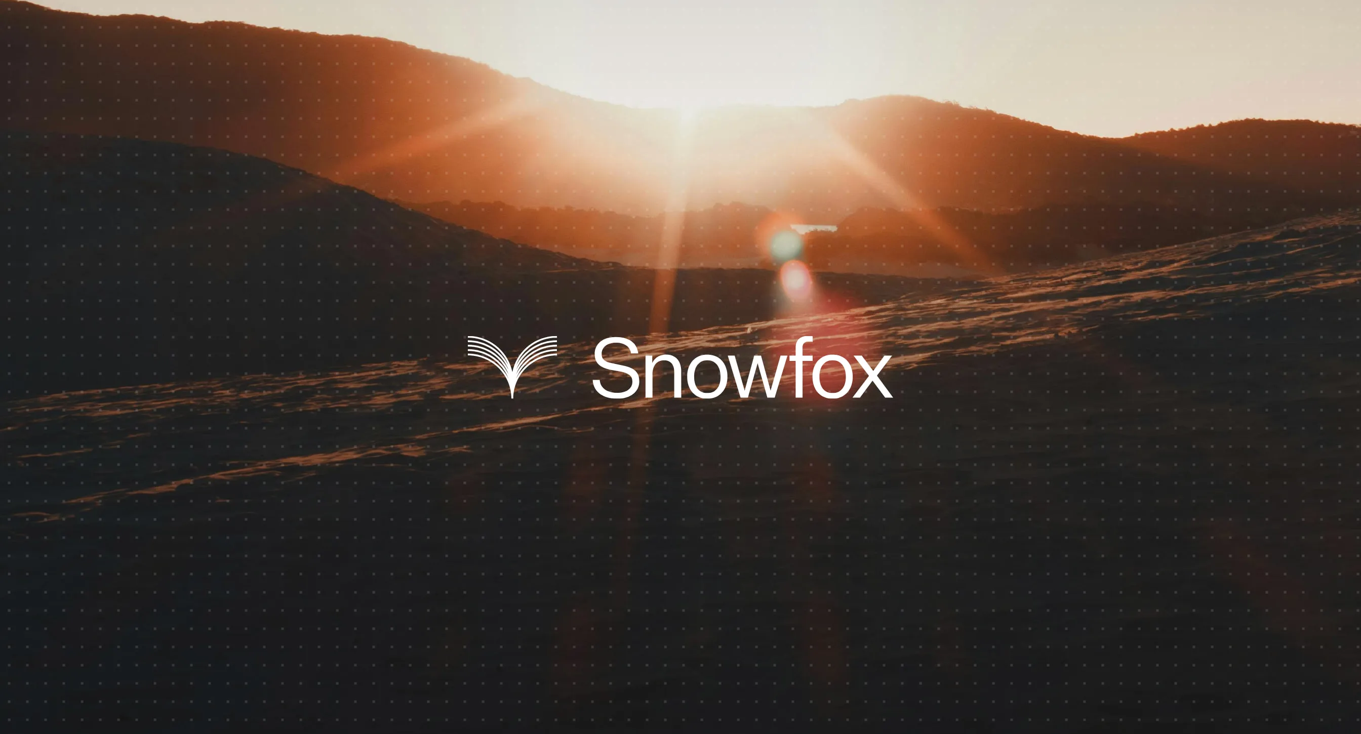 The Snowfox logo over a sunrise across snowy hills