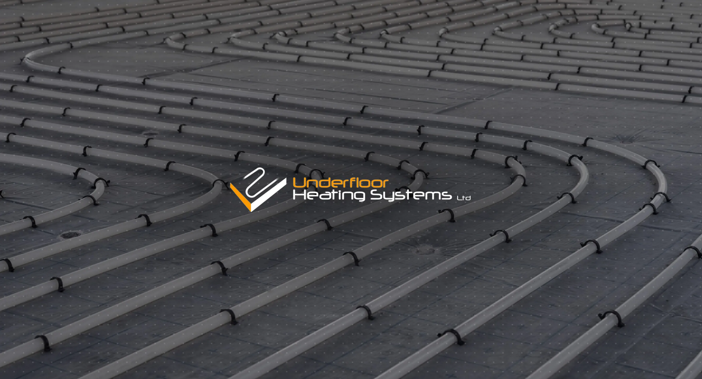 The Underfloor Heating Systems logo over a floor laid with curved heating pipes